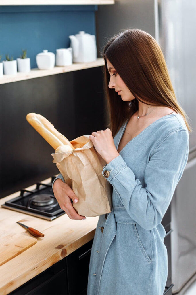 women denim dress in kitchen